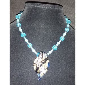 Handmade beaded necklace with unique glass pendant